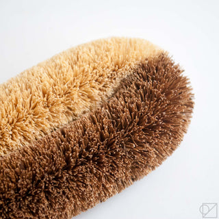 This scrub brush has half very stiff and half regular stiff palm fibers